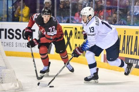 (190522) -- KOSICE, May 22, 2019 -- Thomas Chabot (L) of Canada tackles Johnny Gaudreau of the United States during the 2019 IIHF Ice hockey, Eishockey World Championship, WM, Weltmeisterschaft Slovakia group A game between Canada and the United States at Steel Arena in Kosice, Slovakia, on May 21, 2019. Canada won 3-0. ) (SP)SLOVAKIA-KOSICE-ICE HOCKEY-IIHF-WORLD CHAMPIONSHIP-GROUP A-CAN VS USA LukaszxLaskowski 