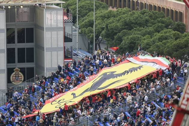 huge Ferrari banner of fans on a grandstand, free practice, seen from above the Ste Devote curve, 90 Formula 1 Grand Prix in the Principality of Monaco