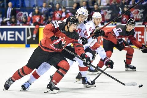 (190524) -- KOSICE, May 24, 2019 -- Lukas Frick (2nd L) of Switzerland tackles Adam Henrique (1st L) of Canada during the 2019 IIHF Ice hockey, Eishockey World Championship, WM, Weltmeisterschaft Slovakia quarter final game between Canada and Switzerland at Steel Arena on May 23, 2019 in Kosice, Slovakia. Canada won 3-2 after overtime. ) (SP)SLOVAKIA-KOSICE-ICE HOCKEY-IIHF-WORLD CHAMPIONSHIP-QUARTERFINAL-CAN-SUI LukaszxLaskowski 