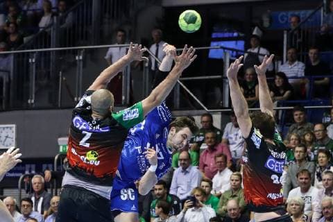 Fynn Herzig VfL Gummersbach vs. Zeljko Musa li and Mads Christiansen SC Magdeburg Handball Bundesliga Season 2018 2019 Punktspiel SC Magdeburg vs. VfL Gummersbach in the GETEC Arena in Magdeburg Action,Germany, Handball, Men,23 05 2019