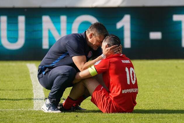 Karsten Hutwelker Coach Wuppertaler SV comforts Gaetano Manno Wuppertaler SV , soccer district sport Niederrheinpokal Final Season 2018 2019 KFC Uerdingen 05 vs. Wuppertaler SV, Wuppertal, Stadium am Zoo, 25 05 2019, Wuppertal Stadium am Zoo Nordrhein Westfalen Germany