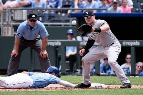 May 25, 2019: Kansas City Royals right fielder Whit Merrifield (15) dives back safely to first pace as the pickoff attempt is being caught by New York Yankees first baseman Luke Voit (45) during the first game of a double header in the American League game between the New York Yankees and the Kansas City Royals held at Kaufmann Stadium in Kansas City, MO CSM MLB, Baseball Herren, USA 2019: Yankees vs Royals May 25 - ZUMAc04_ 20190525_zaf_c04_034 Copyright: xRichardxUlreichx