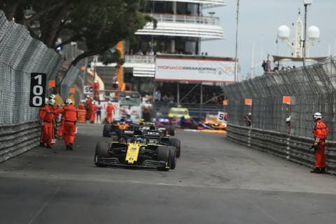 26th May 2019, Monte Carlo, Monaco; F1 Grand Prix of Monte Carlo, race day; Marshalls clear the circuit from debris while Renault F1 Team, Daniel Ricciardo passes them  ActionPlus12138148 Octane