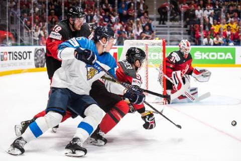 190526 Jere Sallinen of Finland against Pierre Luc Dubois and Troy Stecher of Canada during the 2019 IIHF Ice Hockey World Championship gold medal game between Canada and Finland on May 26, 2019 in Bratislava Photo Joel Marklund BILDBYRAN kod JM 87962,  Copyright: JOELxMARKLUND BB190526JM068