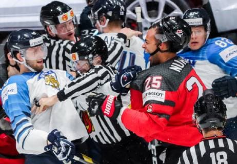 BRATISLAVA, SLOVAKIA - MAY 26, 2019: Finland s Petteri Lindbohm (L) and Canada s Darnell Nurse (R) fight in their 2019 IIHF Ice hockey, Eishockey World Championship, WM, Weltmeisterschaft Gold medal match at Ondrej Nepela Arena. Alexander Demianchuk TASS  TS0ACE1E