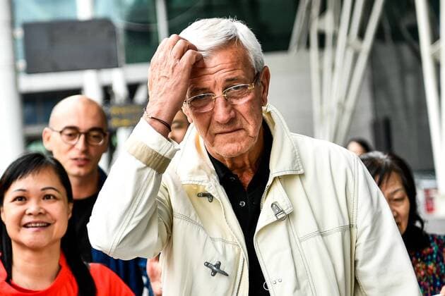 Head coach Marcello Lippi, center, of Chinese national men s football team arrives at the Guangzhou Baiyun International Airport in Guangzhou city, south China s Guangdong province, 28 May 2019. Italy s Marcello Lippi has been re-appointed head coach of the Chinese national football team, the Chinese Football Association (CFA). The World Cup-winning coach will start his second stint with Team Dragon in June ahead of the 2022 World Cup Asian qualifiers which begin in September this year. Marcello Lippi returns as Chinese national team, Nationalteam coach  bjl9964159