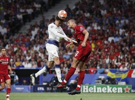 Dele Alli of Tottenham gets above Fabinho of Liverpool to head towards goal during the UEFA Champions League match at Wanda Metropolitano Stadium, Madrid. Picture date: 1st June 2019. Picture credit should read: David Klein Sportimage EDITORIAL USE ONLY. No use with unauthorised audio, video, data, fixture lists, club league logos or live services. Online in-match use limited to 120 images, no video emulation. No use in betting, games or single club league player publications. SPI-0089-0043