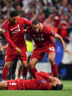190601 Joe Gomez, Joel Matip and Virgil van Dijk of Liverpool celebrate after winning the UEFA Champions League final between Tottenham and Liverpool on June 1, 2019 in Madrid Photo Petter Arvidson BILDBYRAN kod PA 92302,  Copyright: PETTERxARVIDSON BB190601PA159