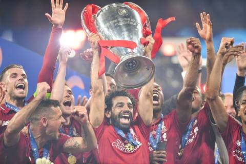 190601 Mohamed Salah of Liverpool raises the throphy in front of team mates at the medal ceremony after the UEFA Champions League final between Tottenham and Liverpool on June 1, 2019 in Madrid Photo Petter Arvidson BILDBYRAN kod PA 92302,  Copyright: PETTERxARVIDSON BB190601PA188