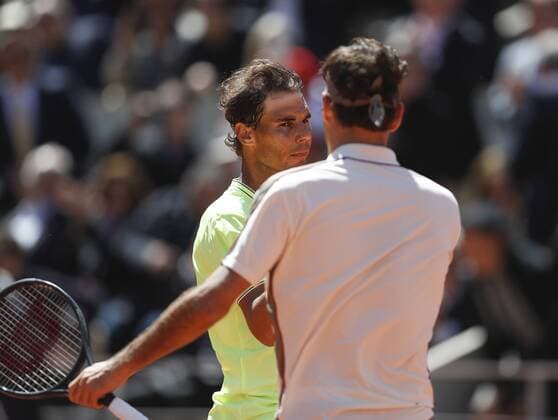 (190607) -- PARIS, June 7, 2019 (Xinhua) -- Rafael Nadal (L) of Spain greets Roger Federer of Switzerland during the men s singles semifinal match between Rafael Nadal of Spain and Roger Federer of Switzerland at French Open tennis tournament 2019 at Roland Garros, in Paris, France on June 7, 2019. Rafael Nadal won 3-0. (Xinhua Han Yan) (SP) FRANCE-PARIS-TENNIS-ROLAND GARROS-DAY 13 