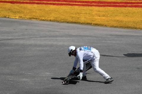 9th June 2019, Circuit Gilles Villeneuve, Montreal, Quebec, Canada; Formula 1 Grand Prix of Canada, Race day; A marshall picks up the Toro Rosso front wing and other debris in corner 1  ActionPlus12142829 Octane