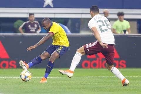 ARLINGTON, TX - JUNE 09: Ecuador midfielder Romario Ibarra (5) shoots the ball past Mexico defender Jorge Sanchez (26) during the game on June 09, 2019 at AT&T Stadium in Arlington, Texas. (Photo by Matthew Pearce Icon Sportswire) SOCCER: JUN 09 Mexico v Ecuador Icon1691906092388
