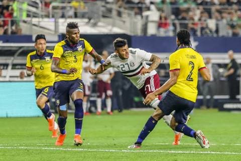 ARLINGTON, TX - JUNE 09: Mexico forward Alexis Vega (27) dribbles the ball through Ecuador defenders during the game on June 09, 2019 at AT&T Stadium in Arlington, Texas. (Photo by Matthew Pearce Icon Sportswire) SOCCER: JUN 09 Mexico v Ecuador Icon1691906092179