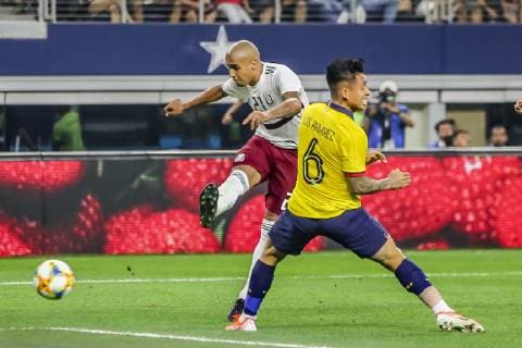 ARLINGTON, TX - JUNE 09: Mexico defender Luis Rodriguez (21) kicks the ball around Ecuador defender Cristian Ram?rez (6) during the game on June 09, 2019 at AT&T Stadium in Arlington, Texas. (Photo by Matthew Pearce Icon Sportswire) SOCCER: JUN 09 Mexico v Ecuador Icon1691906092226