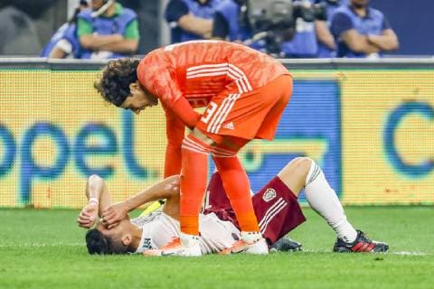 ARLINGTON, TX - JUNE 09: Mexico goalkeeper Guillermo Ochoa (13) checks on Mexico defender Hector Moreno (15) after getting kicked in the skin during the game on June 09, 2019 at AT&T Stadium in Arlington, Texas. (Photo by Matthew Pearce Icon Sportswire) SOCCER: JUN 09 Mexico v Ecuador Icon169190609318