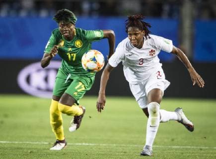 (190611) -- MONTPELLIER, June 11, 2019 (Xinhua) -- Kadeisha Buchanan (R) of Canada vies with Gaelle Enganamouit of Cameroon during the group E match between Canada and Cameroon at the 2019 FIFA Women s World Cup in Montpellier, France on June 10, 2019. Canada won 1-0. (Xinhua Xiao Yijiu) (SP)FRANCE-MONTPELLIER-2019 FIFA WOMEN S WORLD CUP-GROUP E-CANADA VS CAMEROON 