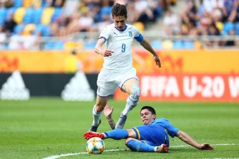 (190612) -- GDYNIA, June 12, 2019 -- Andrea Pinamonti (L) of Italy jumps over Denys Popov of Ukraine during the FIFA U20 World Cup semifinal match between Ukraine and Italy in Gdynia, Poland, June 11, 2019. Ukraine won 1-0 to enter the final. ) (SP)POLAND-GDYNIA-SOCCER-FIFA U20 WORLD CUP-SEMIFINAL PiotrxMatusewicz 