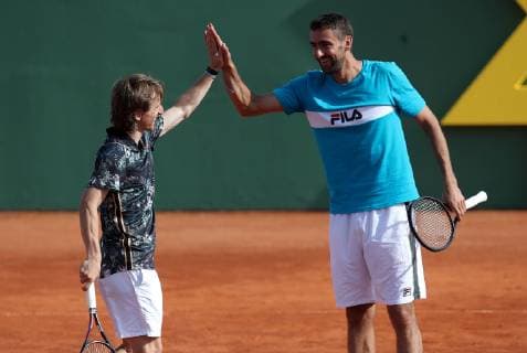 Sport Bilder des Tages (190613) -- ZAGREB, June 13, 2019 -- Luka Modric (L) and Marin Cilic play tennis during Gem Set Croatia, a humanitarian sports event organized by the Marin Cilic Foundation, in Zagreb, Croatia, June 12, 2019. ) (SP)CROATIA-ZAGREB-HUMANITARIAN SPORTS EVENT-GEM SET CROATIA IgorxKralj 