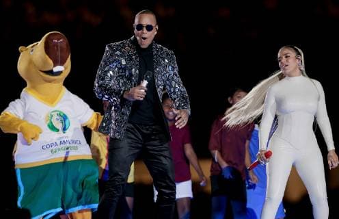 Brazil vs. Bolivia SÃO PAULO, SP - 14.06.2019: BRAZIL VS. BOLIVIA - Zizito mascot, Brazilian singer Léo Santana and Colombian singer Karol G during a pre-match opening ceremony between Brazil and Bolivia, valid for the group stage of the Copa America 2019, held this Friday (14) at the Estádio do Morumbi in Sao Paulo-SP. (Photo: Marcelo Machado de Melo Fotoarena) x1747929x  MarceloxMachadoxdexMelo