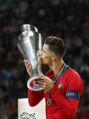 Cristiano Ronaldo of Portugal kisses the Nations League trophy during the UEFA Nations League final match between Portugal and The Netherlands at Estadio do Dragao on June 09, 2019 in Porto, Portugal UEFA Nations League 2018 2019 xVIxVIxImagesx xMauricexvanxSteenxIVx 14740483