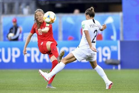(190616) -- GRENOBLE, June 16, 2019 (Xinhua) -- Janine Beckie (L) of Canada shoots during the group E match between Canada and New Zealand at the 2019 FIFA Women s World Cup in Grenoble, France on June 15, 2019. Canada won 2-0. (Xinhua Chen Yichen) (SP)FRANCE-GRENOBLE-2019 FIFA WOMEN S WORLD CUP-GROUP E-CANADA VS NEW ZEALAND 