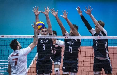 (190616) -- URMIA, June 16, 2019 -- Stephen Timothy Maar (L) of Canada spikes the ball during the FIVB Volleyball Nations League match between Canada and Poland in Urmia, Iran, June 16, 2019. Poland won 3-1. ) (SP)IRAN-URMIA-FIVB VOLLEYBALL LEAGUE-POLAND VS CANADA AhmadxHalabisaz 