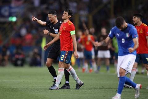 Much to the dismay of Jesus Vallejo of Spain the referee Serdar Gozubuyuk awards a penalty to Italy following a consultation with the VAR during the UEFA Under-21 Championship 2019 match at Renato Dall Ara, Bologna. Picture date: 16th June 2019. Picture credit should read: Jonathan Moscrop Sportimage EDITORIAL USE ONLY. No use with unauthorised audio, video, data, fixture lists, club league logos or live services. Online in-match use limited to 120 images, no video emulation. No use in betting, games or single club league player publications. SPI-0100-0055