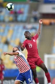 (190617) -- RIO DE JANEIRO, June 17, 2019 (Xinhua) -- Paraguay s Bruno Valdez (L) competes with Almoez Abdulla of Qatar during the Group B match between Qatar and Paraguay at the Copa America 2019, held in Rio de Janeiro, Brazil, June 16, 2019. The match ended with 2-2. (Xinhua Xin Yuewei) (SP)BRAZIL-RIO DE JANEIRO-SOCCER-COPA AMERICA 2019-QATAR VS PARAGUAY 