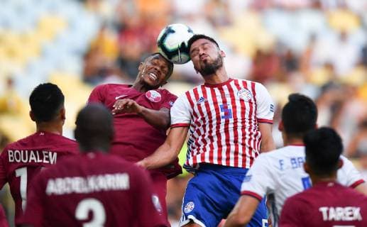 (190617) -- RIO DE JANEIRO, June 17, 2019 (Xinhua) -- Paraguay s Bruno Valdez(3rd, R) competes with Pedro Correia(3rd, L) of Qatar during the Group B match between Qatar and Paraguay at the Copa America 2019, held in Rio de Janeiro, Brazil, June 16, 2019. The match ended with 2-2. (Xinhua Xin Yuewei) (SP)BRAZIL-RIO DE JANEIRO-SOCCER-COPA AMERICA 2019-QATAR VS PARAGUAY 