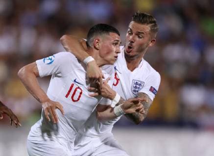 Phil Foden of England celebrates scoring the first goal with James Maddison during the UEFA Under-21 Championship 2019 match at Dino Manuzzi, Cesena. Picture date: 18th June 2019. Picture credit should read: Jonathan Moscrop Sportimage EDITORIAL USE ONLY. No use with unauthorised audio, video, data, fixture lists, club league logos or live services. Online in-match use limited to 120 images, no video emulation. No use in betting, games or single club league player publications. SPI-0101-0028