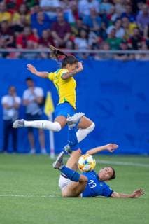 June 18, 2019 - Valenciennes, France - Brazil forward DEBINHA 9 jumps over sliding Italy defender ELISA BARTOLI 13 during a Women s World Cup group C match at Stade du Hainaut in Valenciennes, France. Brazil defeats Italy 1 - 0 Women s World Cup 2019 France - Brazil defeats Italy 1 - 0 - ZUMAs192 20190618_zap_s192_006 Copyright: xMarkxSmithx