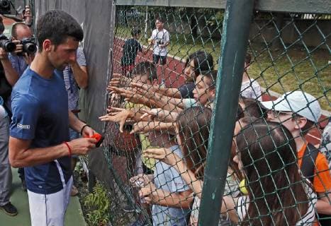 (190619) -- BELGRADE, June 19, 2019 -- Novak Djokovic of Serbia signs autographs during an open training session in Belgrade, Serbia, June 19, 2019. ) (SP)SERBIA-BELGRADE-TENNIS-NOVAK DJOKOVIC PredragxMilosavljevic 