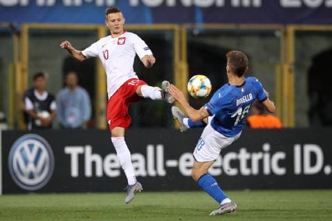 Sebastian Szymanski of Poland and Nicolo Barella of Italy during the UEFA Under-21 Championship 2019 match at Renato Dall Ara, Bologna. Picture date: 19th June 2019. Picture credit should read: Jonathan Moscrop Sportimage EDITORIAL USE ONLY. No use with unauthorised audio, video, data, fixture lists, club league logos or live services. Online in-match use limited to 120 images, no video emulation. No use in betting, games or single club league player publications. SPI-0102-0003