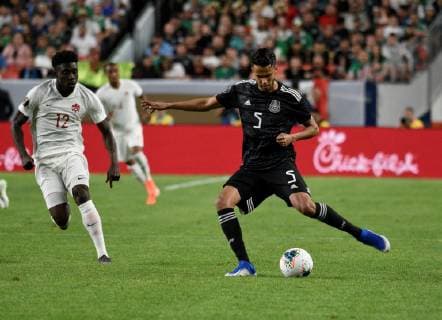 Mexico defender Diego Reyes (R) kicks the ball away from Canada midfielder Alphonso Davies (L) during the first half of the Gold Cup match between Canada and Mexico, at Broncos Stadium at Mile High in Denver, CO, USA, 19 June 2019. Canada vs Mexico !ACHTUNG: NUR REDAKTIONELLE NUTZUNG!  Copyright: xToddxPiersonx AME5036 20190620-636966073278961202