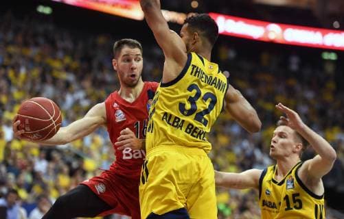 Stefan Jovic FC Bayern , in the duel with Johannes Thiemann ALBA , right Martin Hermannsson ALBA , ALBA Berlin FC Bayern Munich Basketball, easyCredit BBL, German Championship, Playoff, playoffs, play off, DM playoff, finals, finals, 2 games, game 2,men, men, season 2018 2019 Berlin, 19 6 2019 Mercedes Benz Arena