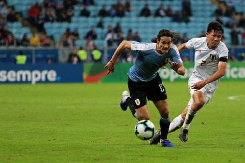 20th June 2019, Arena do Gremio, Porto Alegre, Brazil. Copa America international football, Uruguay versus Japan; Edinson Cavani of Uruguay takes on Daiki Sugioka of Japan  ActionPlus12146044 MaxxPeixoto