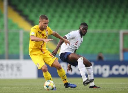 George Puscas of Romania turns Fikayo Tomori of England during the UEFA Under-21 Championship 2019 match at San Marino Stadium, Serravalle. Picture date: 21st June 2019. Picture credit should read: Jonathan Moscrop Sportimage EDITORIAL USE ONLY. No use with unauthorised audio, video, data, fixture lists, club league logos or live services. Online in-match use limited to 120 images, no video emulation. No use in betting, games or single club league player publications. SPI-0103-0006