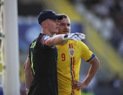 Dean Henderson of England marked by George Puscas of Romania during the UEFA Under-21 Championship 2019 match at San Marino Stadium, Serravalle. Picture date: 21st June 2019. Picture credit should read: Jonathan Moscrop Sportimage EDITORIAL USE ONLY. No use with unauthorised audio, video, data, fixture lists, club league logos or live services. Online in-match use limited to 120 images, no video emulation. No use in betting, games or single club league player publications. SPI-0103-0012