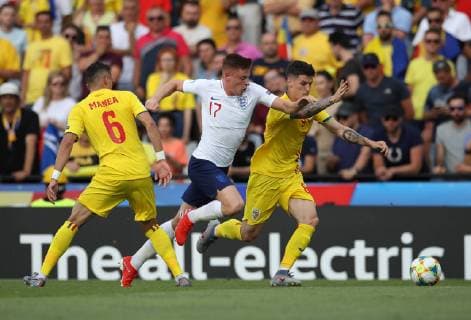 Harvey Barnes of England takes on Dennis Man of Romania during the UEFA Under-21 Championship 2019 match at Stadio Dino Manuzzi, Cesena. Picture date: 21st June 2019. Picture credit should read: Jonathan Moscrop Sportimage EDITORIAL USE ONLY. No use with unauthorised audio, video, data, fixture lists, club league logos or live services. Online in-match use limited to 120 images, no video emulation. No use in betting, games or single club league player publications. SPI-0103-0007