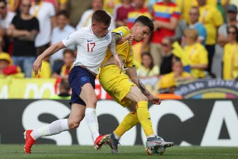 Harvey Barnes of England tussles with Dennis Man of Romania during the UEFA Under-21 Championship 2019 match at Dino Manuzzi, Cesena. Picture date: 21st June 2019. Picture credit should read: Jonathan Moscrop Sportimage EDITORIAL USE ONLY. No use with unauthorised audio, video, data, fixture lists, club league logos or live services. Online in-match use limited to 120 images, no video emulation. No use in betting, games or single club league player publications. SPI-0103-0095