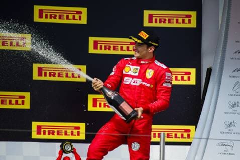 23rd June 2019, Circuit Automobile Paul Ricard, Le Castellet, Marseille, France ; FIA Formula 1 Grand Prix of France, Race Day; Charles Leclerc of the Ferrari Team celebrates the third place on the podium with a champagne shower  ActionPlus12147179 PabloxGuillen