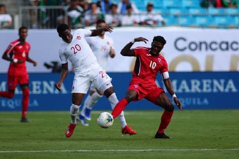 CHARLOTTE, NC - JUNE 23: Canada forward Jonathan David (20) and Cuba midfielder Aricheell Hernandez (10) fight for the ballduring the 1st half of the CONCACAF Gold Cup game with Canada versus Cuba on June 23rd, 2019, at Bank of America Stadium in Charlotte, NC. (Photo by Jaylynn Nash Icon Sportswire) SOCCER: JUN 23 CONCACAF Gold Cup Group A - Canada v Cuba Icon19062300021
