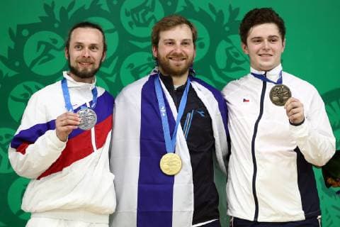 MINSK, BELARUS â€“ JUNE 24, 2019: Silver medallist Sergei Kamensky of Russia, gold medallist Sergey Richter of Israel, and bronze medallist Filip Nepejchal of the Czech Republic, from left, pose at a victory ceremony for a men s 10m air rifle event at the Minsk 2019 Europaspiele Sergei Bobylev TASS  TS0B0B6F