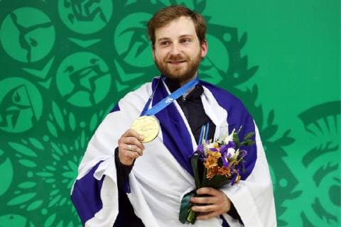 MINSK, BELARUS â€“ JUNE 24, 2019: Israel s Sergey Richter poses with his gold medal at a victory ceremony for a men s 10m air rifle event at the Minsk 2019 Europaspiele Sergei Bobylev TASS  TS0B0B75