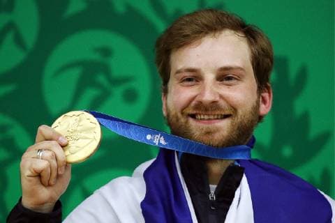 MINSK, BELARUS â€“ JUNE 24, 2019: Israel s Sergey Richter poses with his gold medal at a victory ceremony for a men s 10m air rifle event at the Minsk 2019 Europaspiele Sergei Bobylev TASS  TS0B0B86