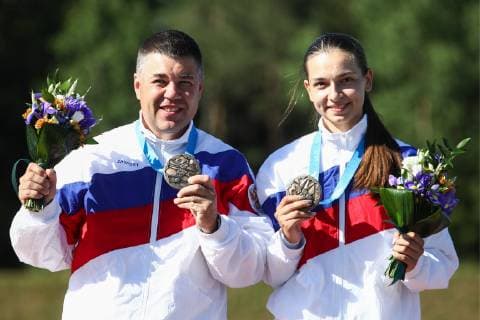 MINSK, BELARUS â€“ JUNE 24, 2019: Athletes Alexei Alipov (L) and Daria Semyanova of Russia celebrate winning bronze medals at a victory ceremony following the mixed trap shooting event at the Minsk 2019 Europaspiele Sergei Bobylev TASS  TS0B0BEC