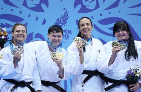 MINSK, BELARUS - JUNE 24, 2019: Athletes Larisa Ceric of Bosnia and Herzegovina, Maryna Slutskaya of Belarus, Ksenia Chibisova of Russia and Iryna Kindzerska (L-R) of Azerbaijan pose with their medals at a victory ceremony after the women s heavy weight (78+kg) judo event at the 2nd Europaspiele Natalia Fedosenko TASS  TS0B0C98