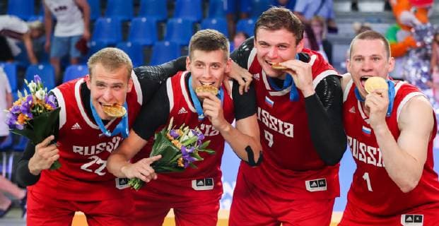 MINSK, BELARUS - JUNE 24, 2019: Russia s Alexei Zherdev, Kirill Pisklov, Ilya Karpenkov and Stanislav Sharov (L-R) pose with their gold medals at a victory ceremony after the men s 3x3 basketball event at the 2nd Europaspiele Russia won 21-14. Natalia Fedosenko TASS  TS0B0CE1