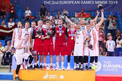 MINSK, BELARUS - JUNE 24, 2019: Latvian, Russian and Belarusian players pose with their medals at a victory ceremony after the men s 3x3 basketball event at the 2nd Europaspiele Russia won 21-14. Natalia Fedosenko TASS  TS0B0CE3