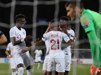 Reiss Nelson of England celebrates scoring the first goal during the UEFA Under-21 Championship 2019 match at San Marino Stadium, Serravalle. Picture date: 24th June 2019. Picture credit should read: Jonathan Moscrop Sportimage EDITORIAL USE ONLY. No use with unauthorised audio, video, data, fixture lists, club league logos or live services. Online in-match use limited to 120 images, no video emulation. No use in betting, games or single club league player publications. SPI-0105-0012